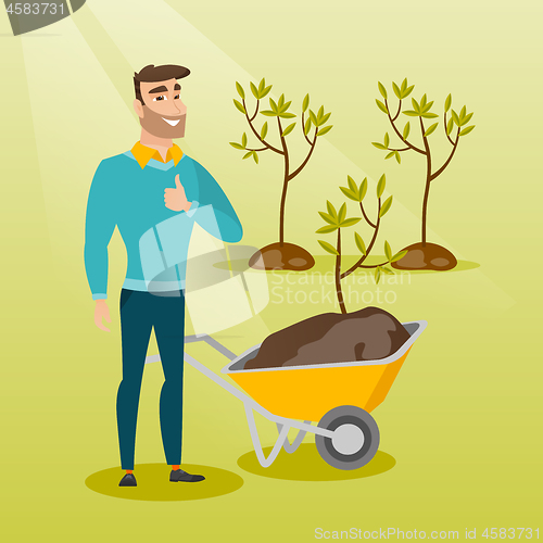 Image of Man pushing wheelbarrow with plant.