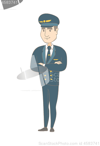 Image of Young caucasian pilot standing with folded arms.