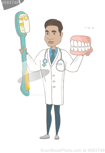 Image of Dentist with dental jaw model and toothbrush.