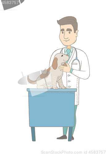 Image of Young caucasian veterinarian examining dog.