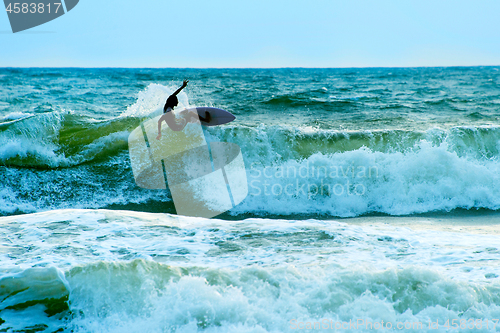 Image of Surfer in the ocean. Bali