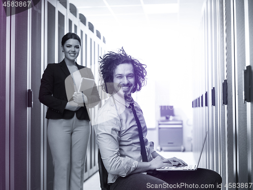 Image of Team of young technicians working together on servers