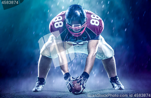 Image of American football player starting football game