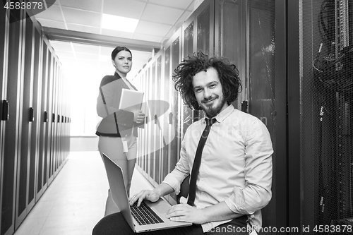 Image of Team of young technicians working together on servers