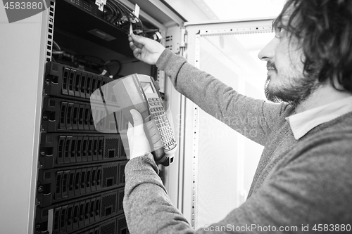 Image of technician using digital cable analyzer