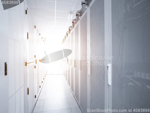 Image of modern server room with white servers