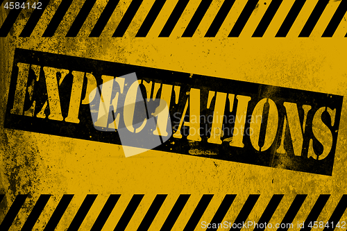 Image of Expectations sign yellow with stripes