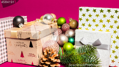 Image of Christmas decoration gift box with pink background