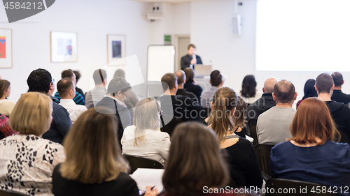 Image of Business speaker giving a talk at business conference event.