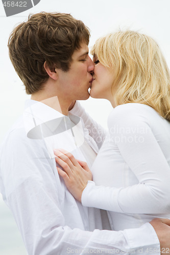 Image of Caucasian couple kissing