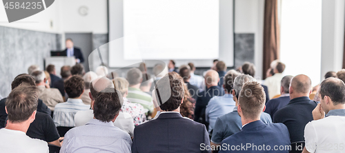 Image of Business speaker giving a talk at business conference event.