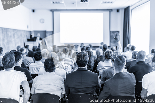 Image of Business speaker giving a talk at business conference event.