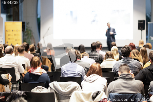 Image of Business speaker giving a talk at business conference event.