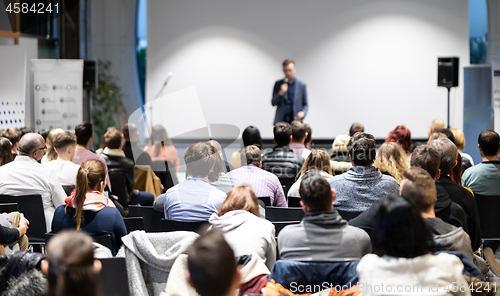 Image of Business speaker giving a talk at business conference event.