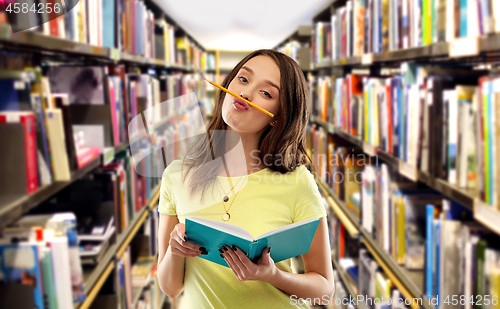 Image of teenage student girl with notebook and pencil