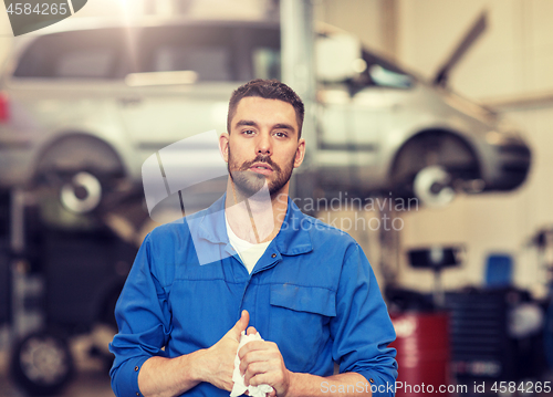 Image of auto mechanic man or smith at car workshop