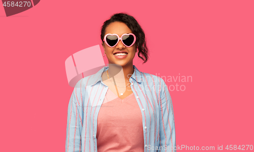 Image of african american woman in heart-shaped sunglasses