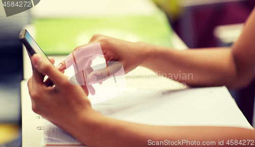 Image of close up of african student with smartphone