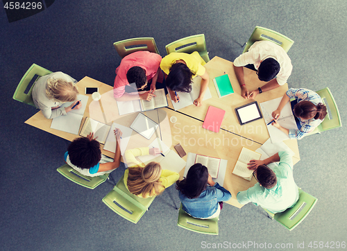 Image of group of students with tablet pc at school library