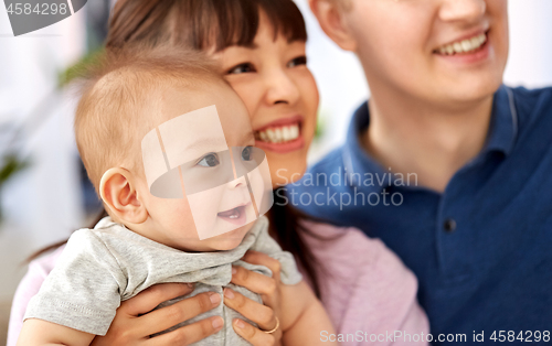 Image of close up of happy mixed-race family with baby son