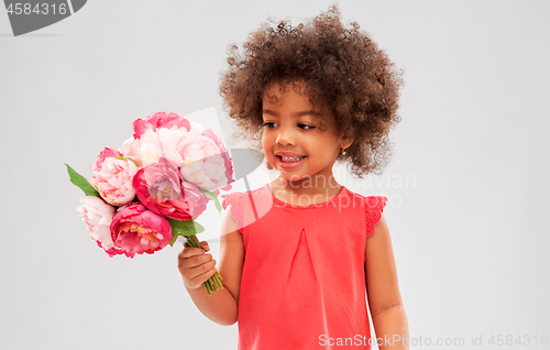 Image of happy little african american girl with flowers