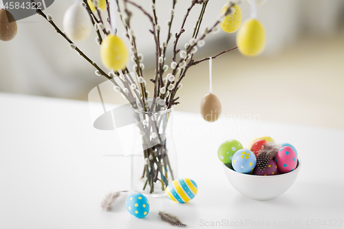 Image of pussy willow branches decorated by easter eggs