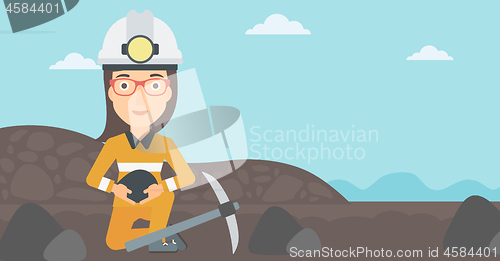 Image of Miner holding coal in hands.