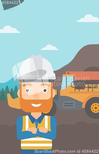 Image of Miner with mining equipment on background.