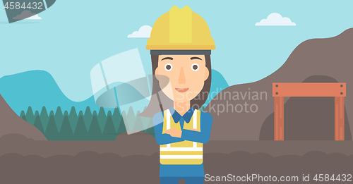 Image of Miner with mining equipment on background.