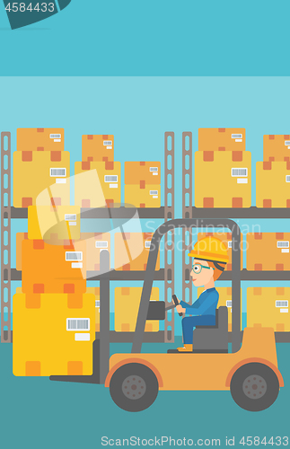 Image of Warehouse worker moving load by forklift truck.