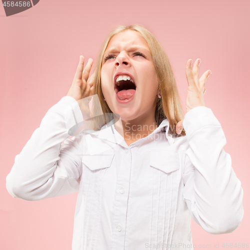 Image of Isolated on pink young casual teen girl shouting at studio