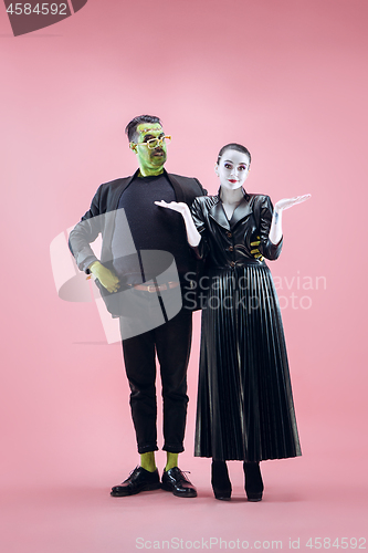 Image of Halloween Family. Happy couple in Halloween Costume and Makeup