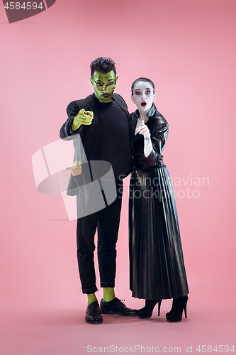 Image of Halloween Family. Happy couple in Halloween Costume and Makeup