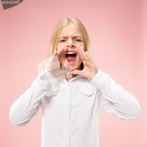 Image of Isolated on pink young casual teen girl shouting at studio