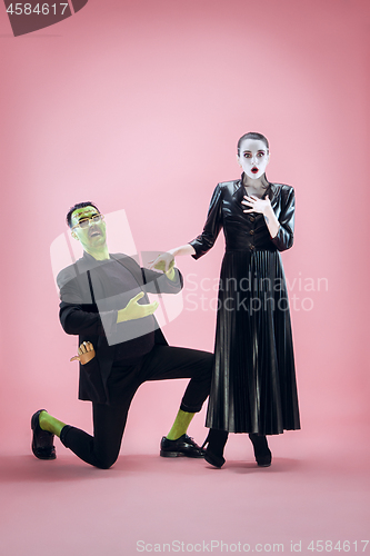 Image of Halloween Family. Happy couple in Halloween Costume and Makeup