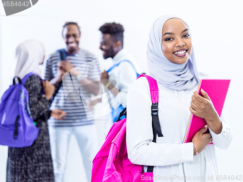 Image of portrait of african female student with group of friends