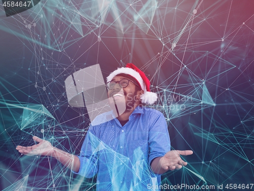 Image of Indian man wearing traditional Santa Claus hat and ai gues his n