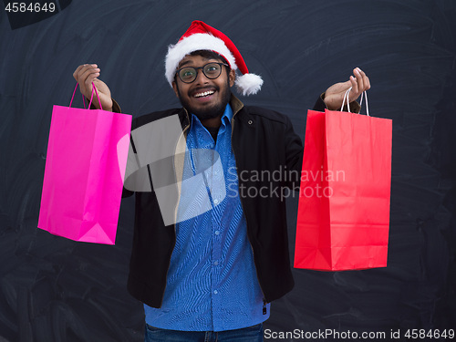 Image of Indian Santa with shopping bags