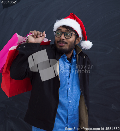 Image of Indian Santa with shopping bags