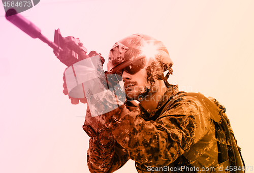 Image of soldier aiming laseer sight optics white background