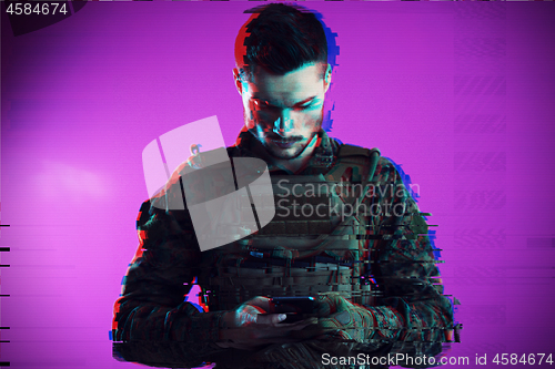 Image of soldier using smartphone glitch