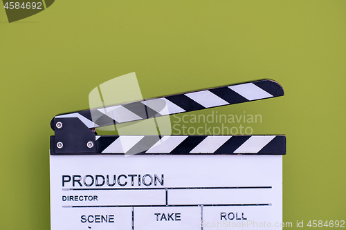 Image of movie clapper on green chroma background