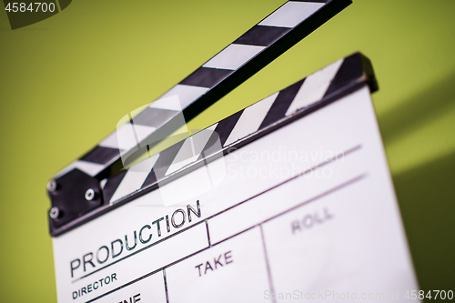 Image of movie clapper on green chroma background