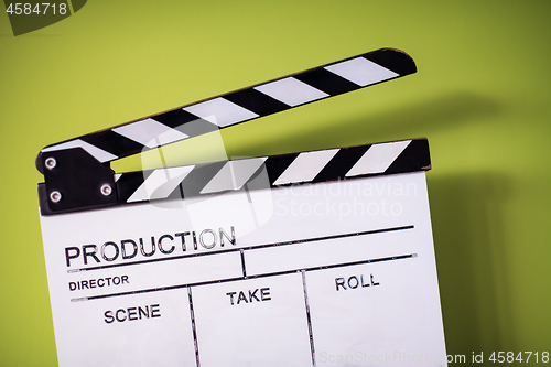 Image of movie clapper on green chroma background