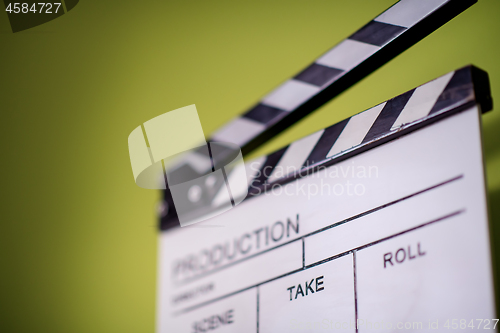 Image of movie clapper on green chroma background