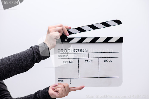 Image of movie clapper on white background