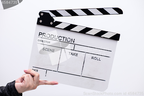 Image of movie clapper on white background