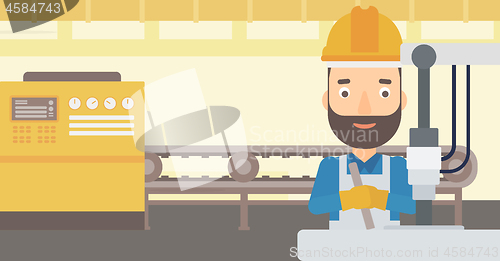 Image of Man working with industrial equipment.