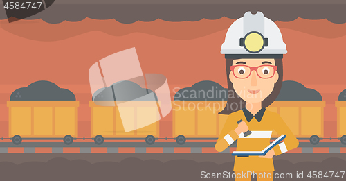 Image of Miner checking documents.