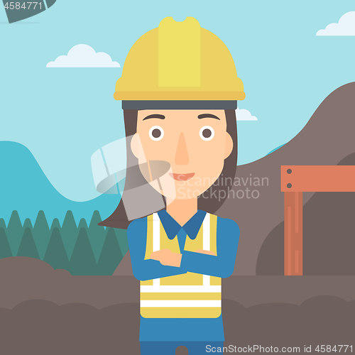 Image of Miner with mining equipment on background.